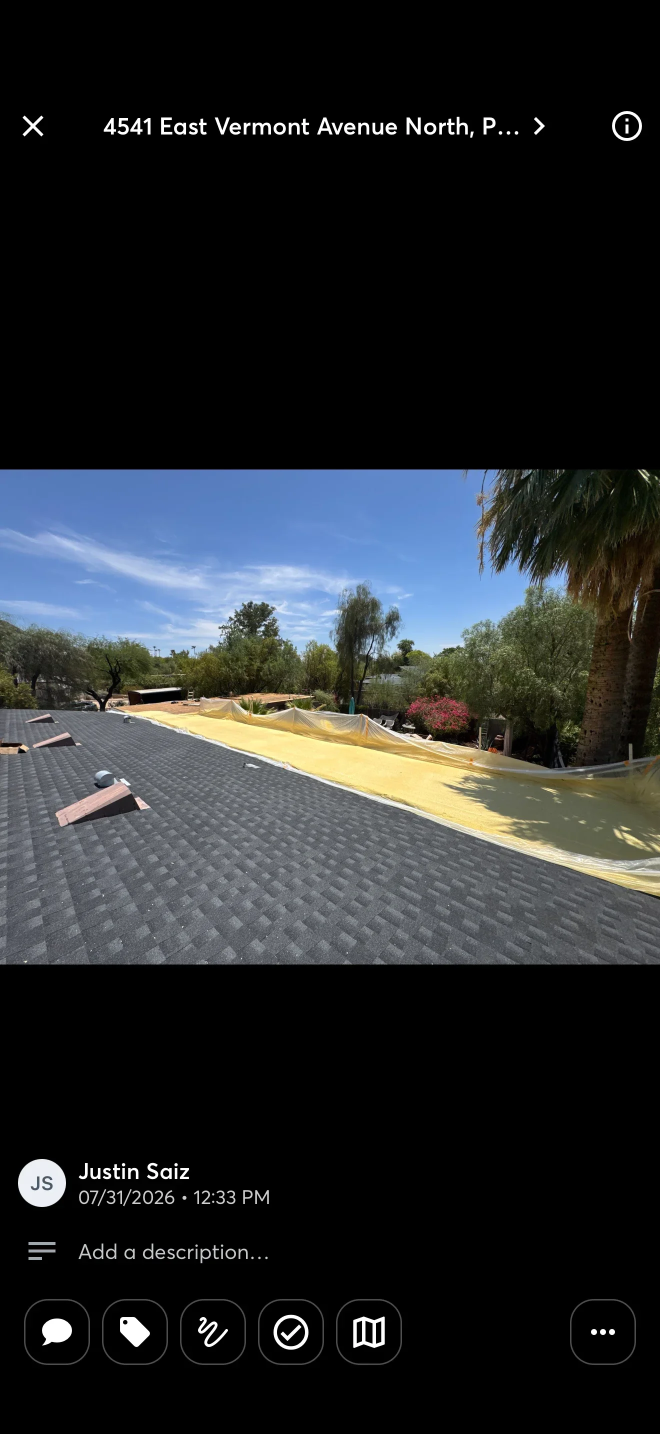 Architectural shingle roof installation with yellow underlayment on residential home
