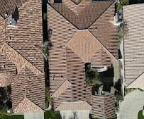 Aerial view of installed dimensional asphalt shingles on residential roof with proper flashing