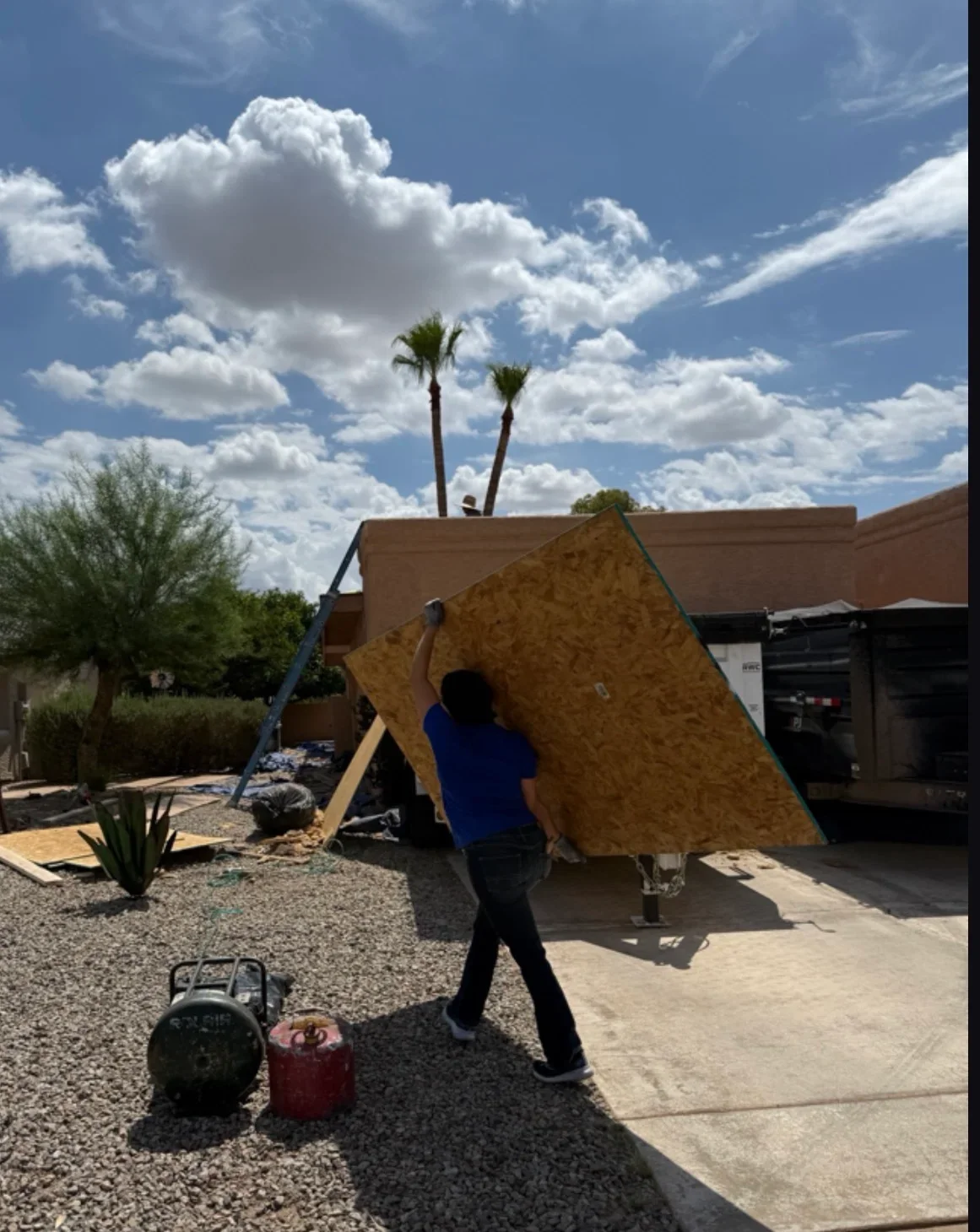OSB roof sheathing installation with bracing on residential roof framing